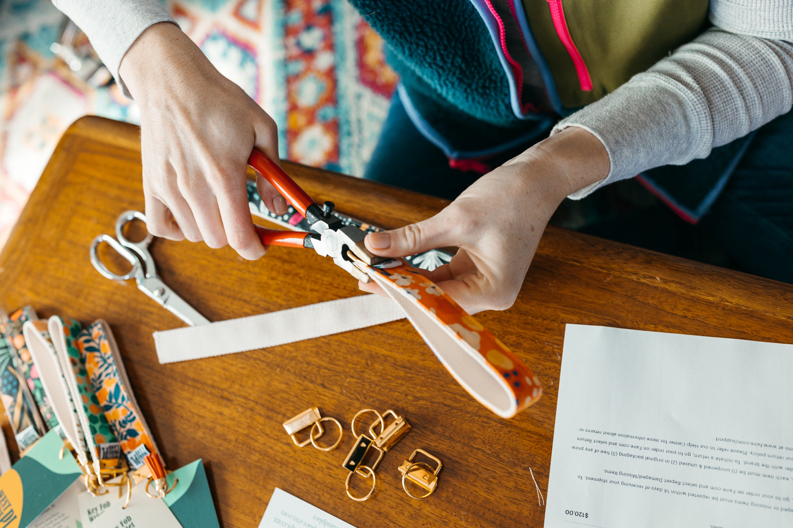 Westmoreland Place - hands making key fob wristlets